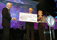 Gail Cochran presenting a check to President Milton A. Gordon