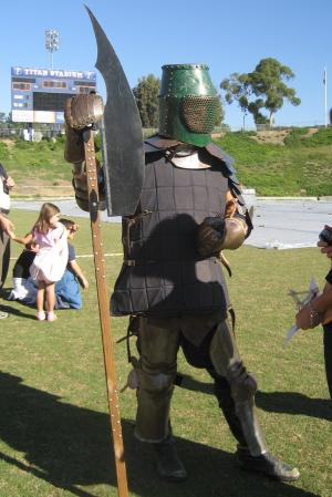 Member of Kingdom of Esperance wears a suit of armor.