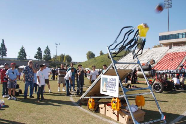 Pumpkin launched via trebuchet built by a Boeing Team.