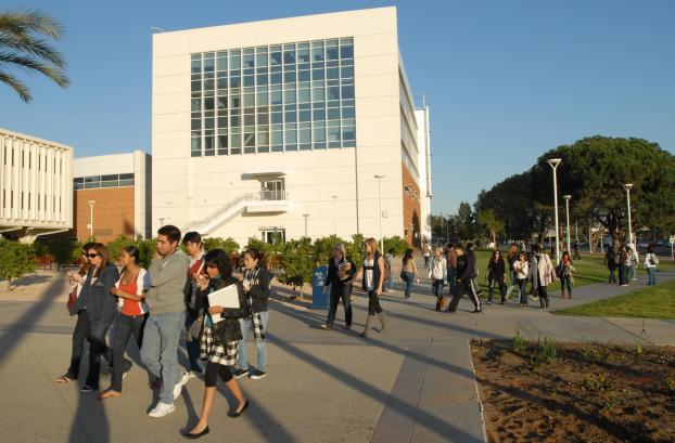 Students walking by Mihaylo Hall