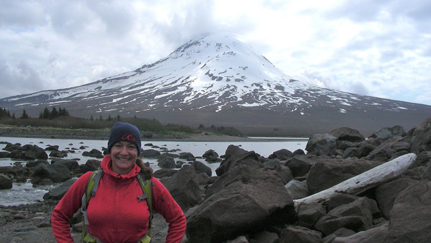 Vitale stands before a snow-covered mountain.