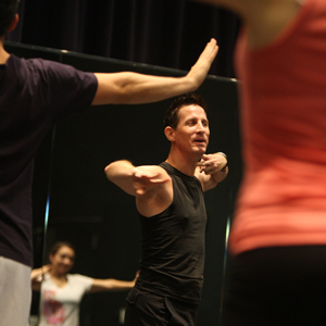 Matthew J. Vargo leads students through a dance move.