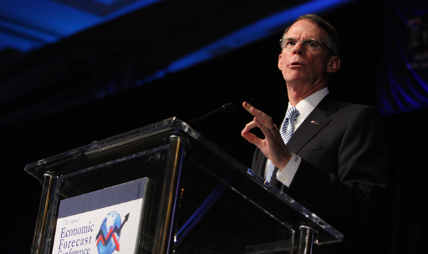 Richard Davis speaks at the podium during the 17th annual Economic Forecast presentation.