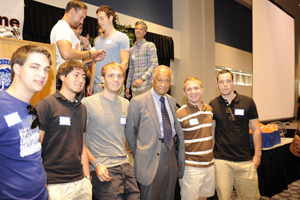 President Gordon surrounded by male international students.