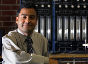 Binod Tiward sits infront of some test equipment
