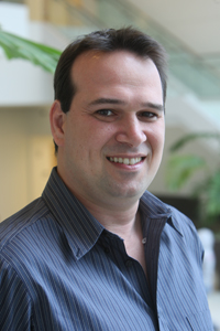 Ofir Turel on the stairs in the lobby of Mihaylo Hall.