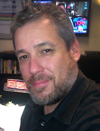 close-up photo of Village Voice Editor Tony Ortega.