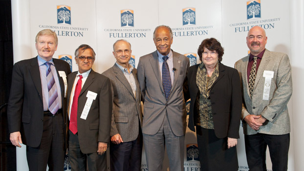 Faculty members who have served CSUF for 30 years pose with President Milton A. Gordon