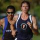 Two runners - one wearing a CSUF jersey.