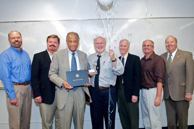 Outstanding Professor Recipient Martin Bonsangue surrounded by Milton A. Gordon and other faculty members.