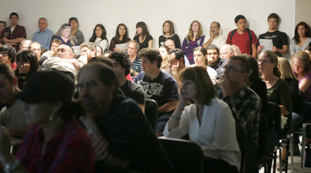 Faculty, staff and students listen to the March 16 presentation.