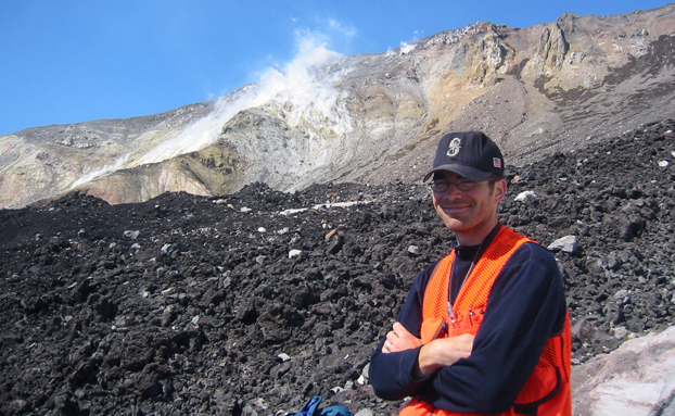 Brandon Browne before an inactive volcano