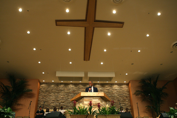President Milton A. Gordon speaks to a church congregation.
