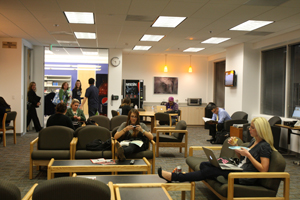 Students relax in the lounge of the Irvine Campus.