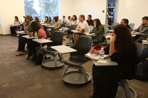 Students attend a class at the Irvine Campus.