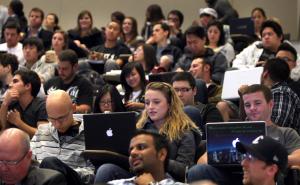 Students attend the Dec. 2 talk by Peter Levene, chairman of Lloyds of London