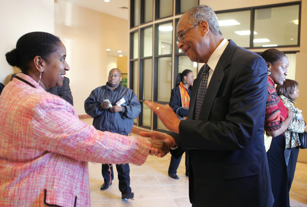 Wanda Wade shakes the hand of Cal State Fullerton President Milton A. Gordon at the end of the service.  