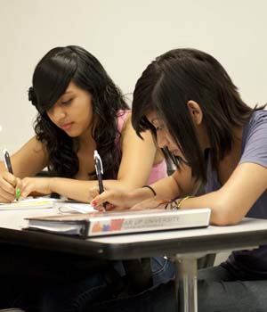 two students study science as part of the GEAR Up program.