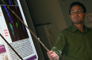 Samuel Hong Uses a pointer to show a cell during a recent presentation.