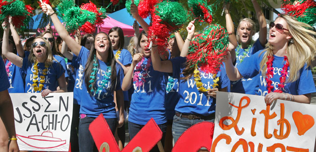 Sorority sisters wave pom-poms during Greek Week festivities.