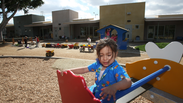 Children playing on the playground at the CSUF Children's Center.
