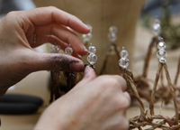 hands working on a crown