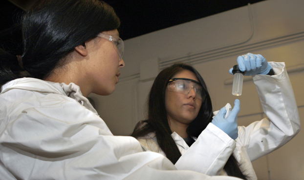 Two female students work in the engineering lab.