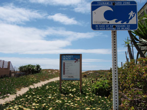 A tsunami warning sign posted at Sunset Beach