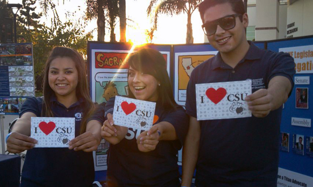 Students hold postcards