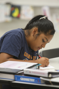 A female student works on a math problem.