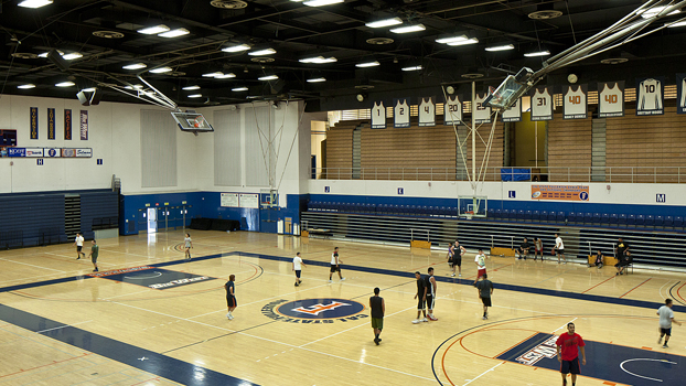 basketball players on a well-lit court.