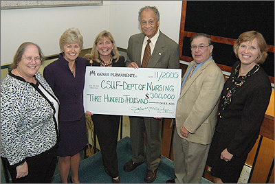 Kaiser Permanente presented a check to CSUF delegates