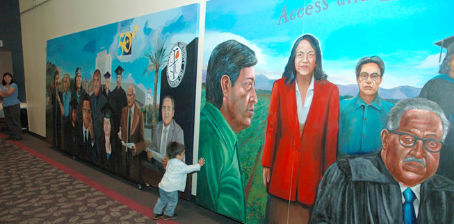 Olin Mateo Morales Hyder examines the campus mural