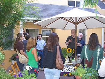 Dean Thomas P. Klammer speaks with Persian Institute students at his home.
