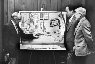 Leo Shapiro pointing at a map of the campus