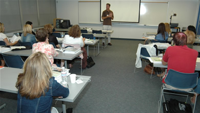 Twenty-five high school English teachers learn how to better prepare their students for college at a recent workshop taught by Chris Street, associate professor of secondary education.
