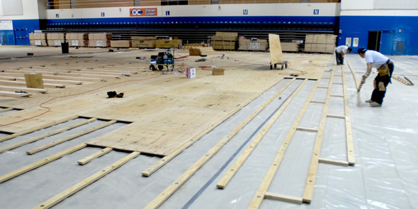 Workers remodelling the floor of the Titan Gym