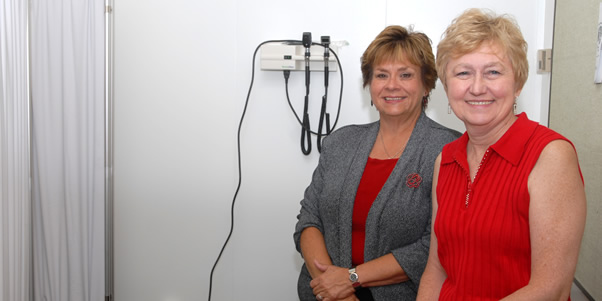 Program leaders Maryanne Garon and Jo-Anne Andre pose with some medical equipment.