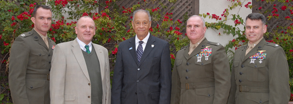 President Milton A. Gordon meets with other campus officials to discuss how the university can encourage and support military personnel in their educational endeavors.