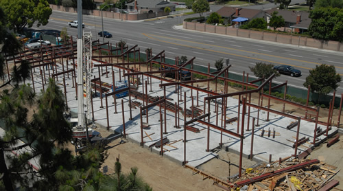 Exposed metal girders form the skeleton of a building