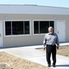 Silas Abrego standing in front of the new Valencia Community Center