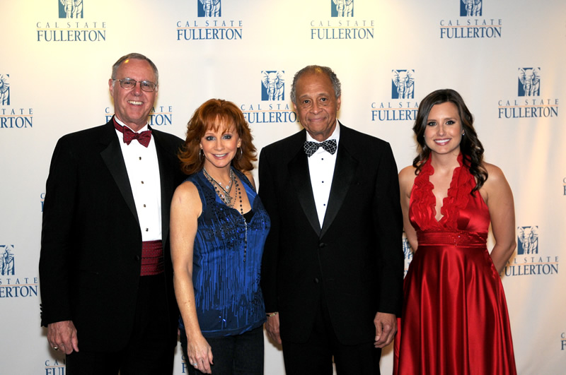 First American Corp.CEO Parker Kennedy poses with Reba, Milton A. Gordon and Ashley Force Hood