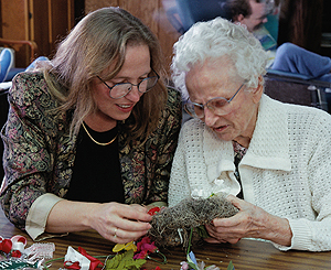 Volunteer working with a senior citizen
