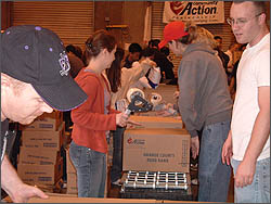 Students packing boxes at the Orange County Food Bank