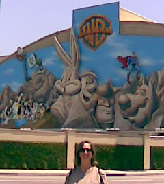 Sheila in front of the Warner Bros. mural