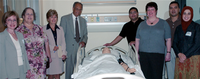 Campus educators and students recently explored the new nursing facility in the Kinesiology and Health Science Building. The simulation lab will be used by 65 graduate students in the new “entry-level” master’s degree in nursing program. Among those pictured are, on the left, Mary Wickman, director of the new program; Paula Herberg, Roberta Rikli and President Milton A. Gordon.