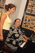 Faculty, student rehearsing a song