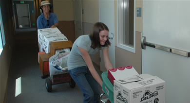 Dad Tom Johnson leads the way as his daughter Laura, an incoming President’s Scholar, brings more things during the move into the residence halls on Wednesday, Aug. 15