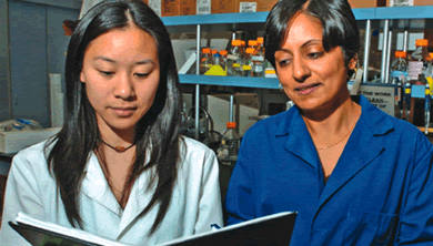 Kim Trinh and Chandra Srinivasan check their data