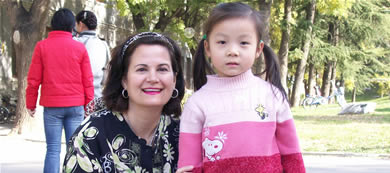 Nancy Snow greets, and has her photo taken, with a little friend. 